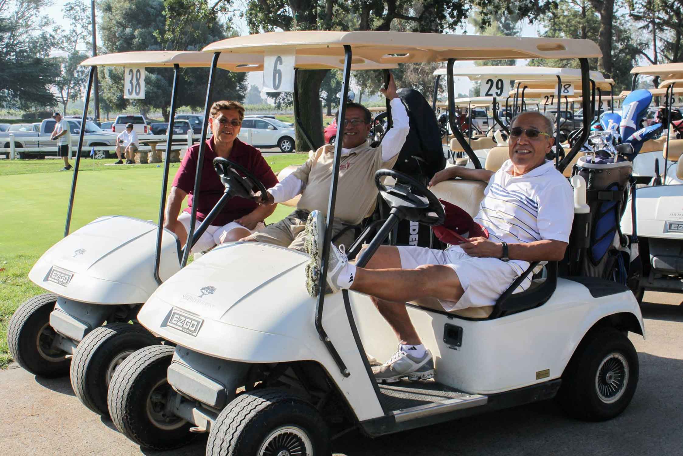 Members of La Raza Law playing golf.